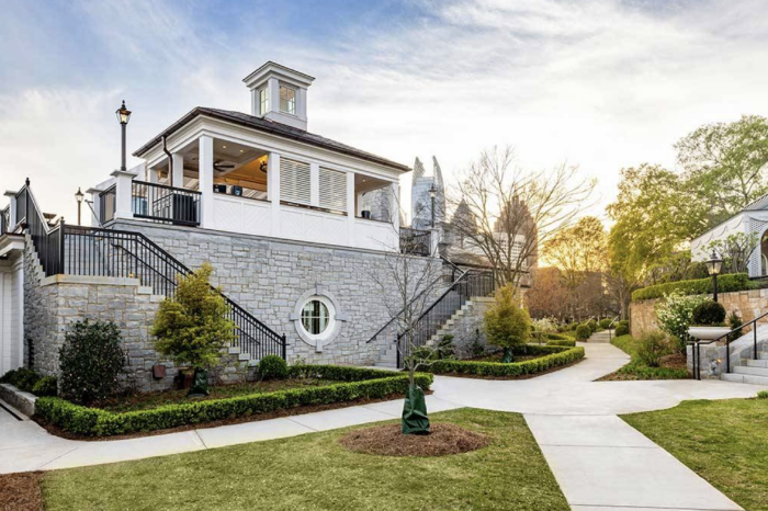 Front facade and walking paths with stairs to the new Piedmont Driving Club Poolside Bar and Event Space featuring a two-story restaurant, bar, and versatile event space located adjacent to the existing pool.