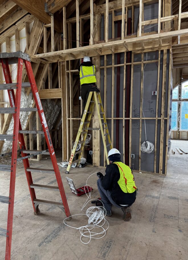 Two Macrotek experts installing Low Voltage wiring.