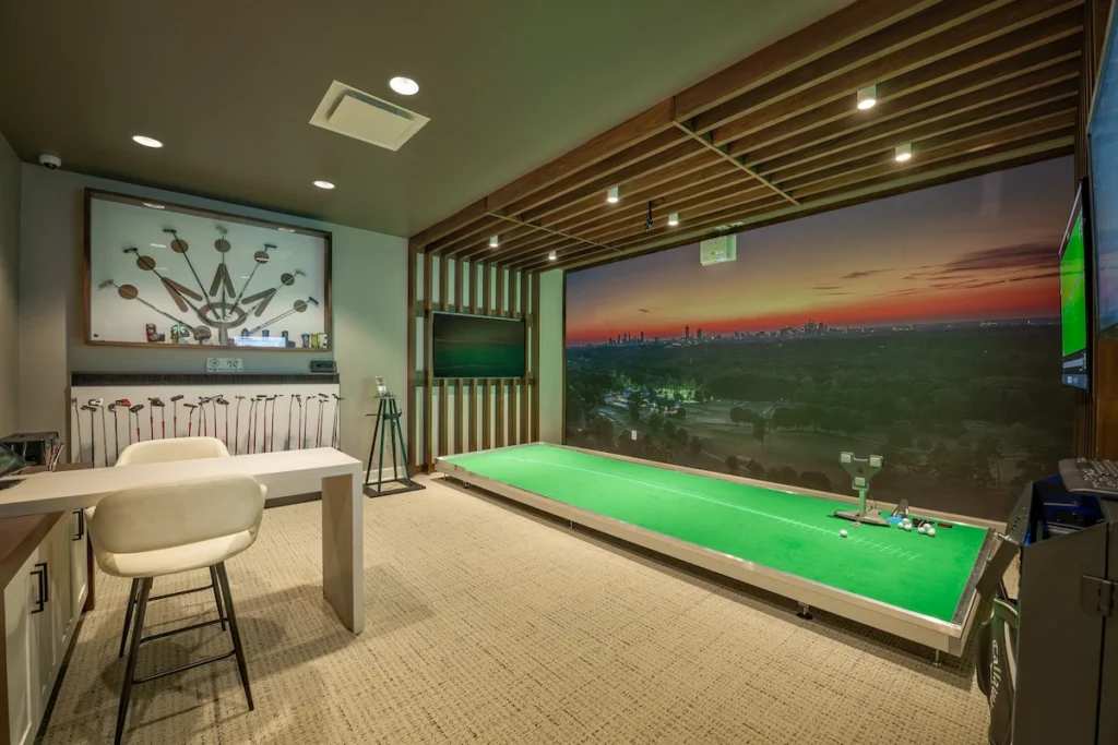 Private club indoor golf simulator showcasing how a trusted technology partner integrates AV and training tech to enhance member amenities