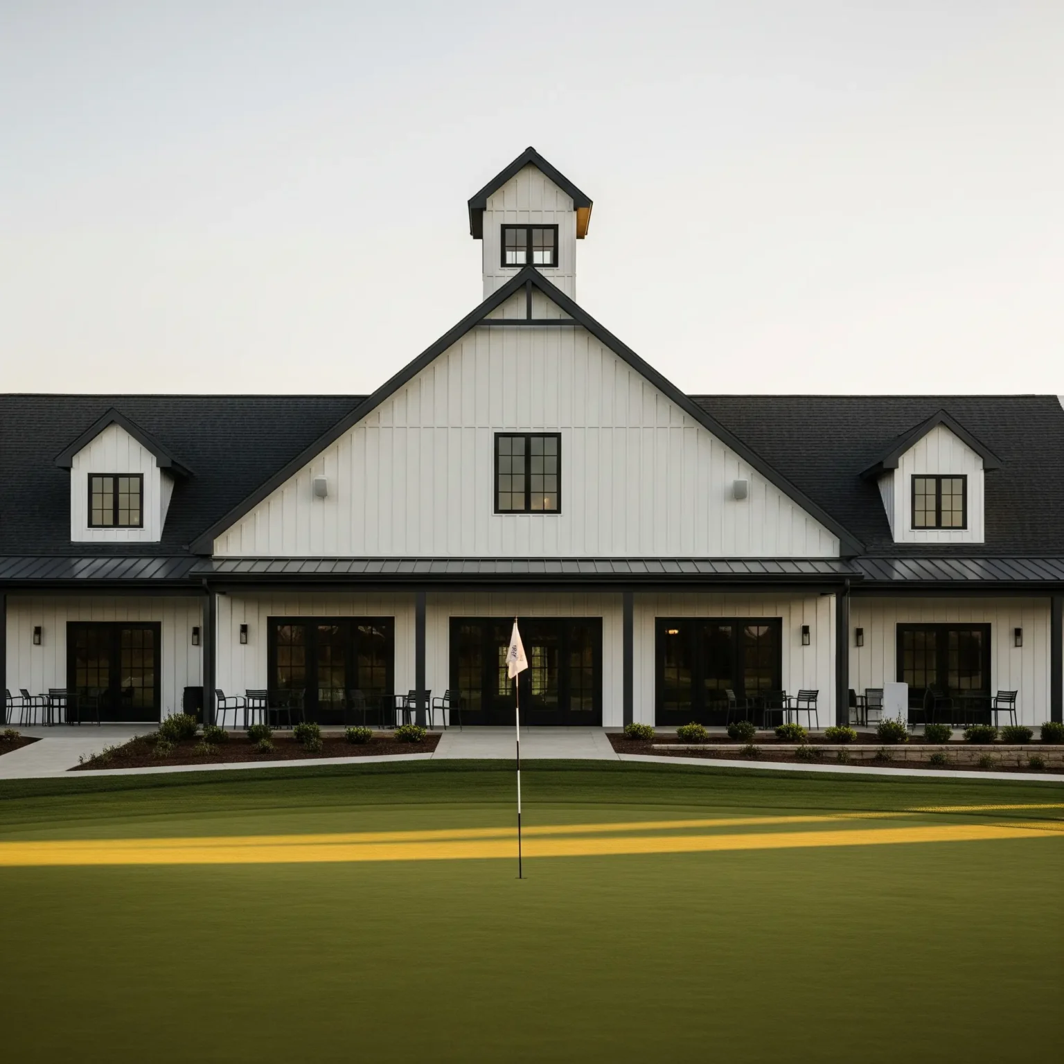 Elegant golf club exterior with integrated AV system and modern lighting