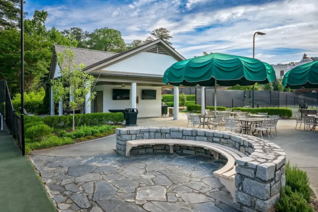 Private club tennis pavilion with integrated outdoor AV system