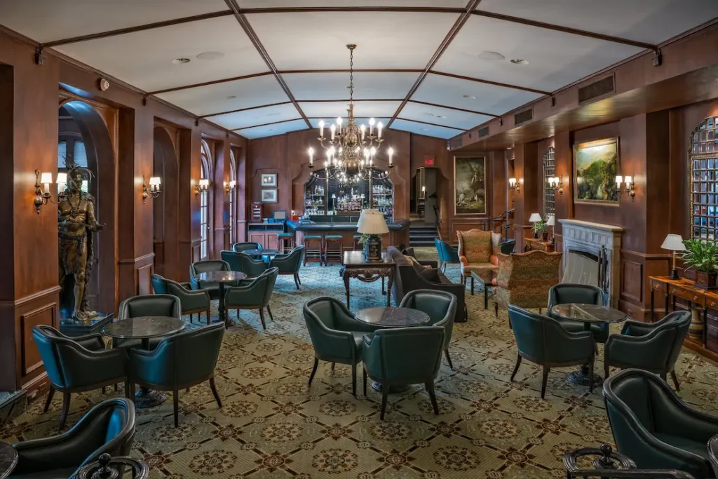 Classic club bar area with ambient lighting and modern audio integration