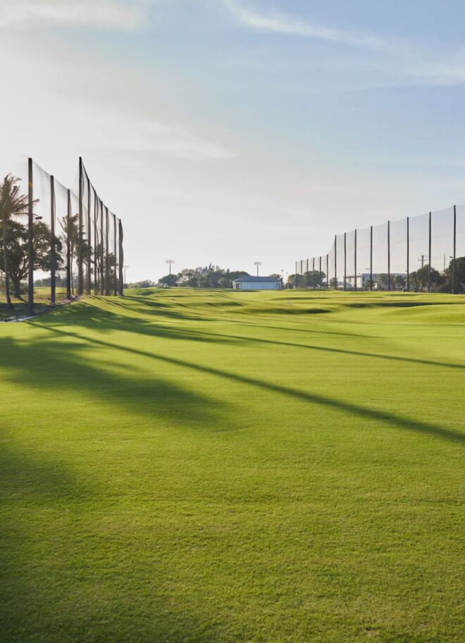 Practice area with distributed audio system along driving range